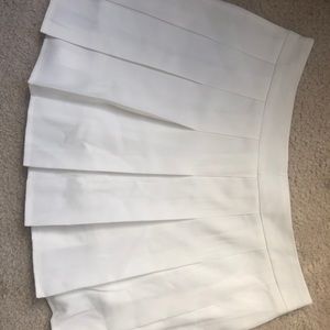 White pleated skirt
